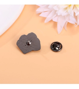 Detailed back view of medical brooch with metal butterfly clutch and pin fastener