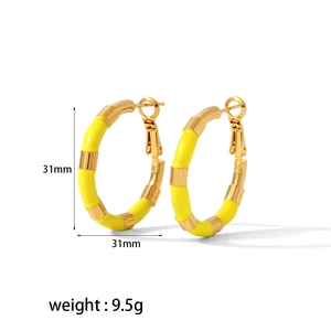 Detail view of 31mm 18K gold plated hoop earrings with yellow enamel and post closure