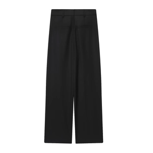 Back view of black wide-leg wrap trousers with belt loops and textured fabric drape