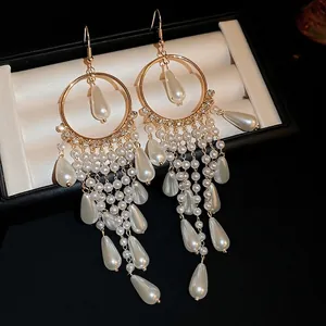 Luxury geometric gold earrings with pearl drop tassels and sparkling crystal accents