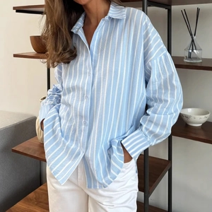 Women's light blue vertical striped long-sleeved button-down shirt in loose fit