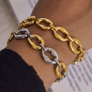 Two-tone chunky titanium steel chain bracelet with organic hammered texture on model