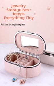 Detail of a pink PU leather portable jewelry box featuring a mirror and organized compartments