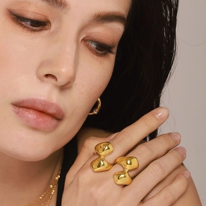 Irregular geometric gold-plated stainless steel rings in minimalist organic style