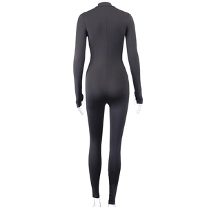 Rear view of black long sleeve tight jumpsuit showing slim fit and back zipper