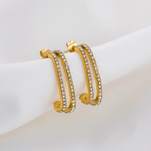 Macro detail of double-row pavé zircon earrings in 18K gold plated stainless steel