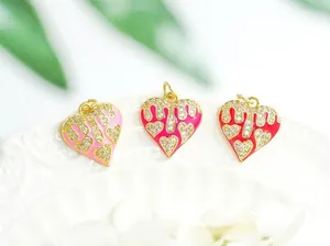 Macro shot of colorful enamel heart charms with 18K gold plating and pavé zircon details