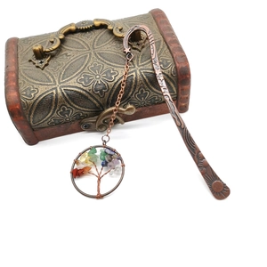 Detailed view of bronze metal bookmark featuring handmade tree of life with crystal stones
