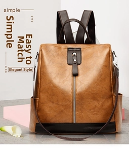 Front view of a brown vintage PU leather backpack with silver zippers and durable straps