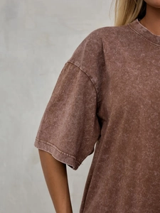 Detailed view of washed vintage cotton T-shirt shoulder stitching and fabric texture