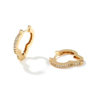 Fashionable gold geometric earrings with sparkling white zircons on a white background