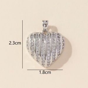 Silver heart pendant with sparkling cubic zirconia measuring 2.3 cm in height and 1.8 cm in width