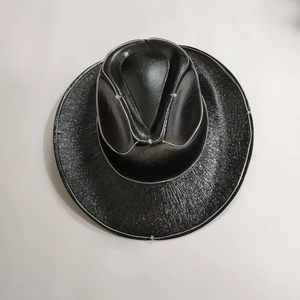 Detailed top view of black reflective LED cowboy hat with holographic shiny texture
