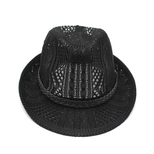 Detail of black knit fedora hat with breathable mesh texture and decorative ribbon band