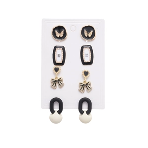 8-piece vintage earrings set with butterfly bow motifs and pearl accents in monochrome
