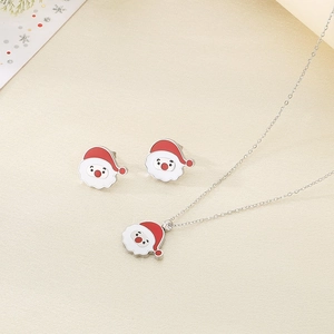 Detail view of Santa Claus necklace and earrings set with red enamel in silver finish