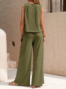 Rear view of olive green two-piece set featuring a sleeveless top and wide-leg trousers