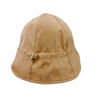Women's khaki nylon bucket hat with adjustable drawstring and waterproof sun protection