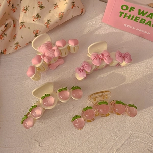 Set of four sweet pink peach and teddy bear hair claws with bows for girls' styling