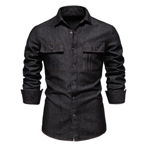 Detailed shot of dark denim shirt with brown contrast stitching and chest pockets