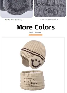 Detailed knit of children's fleece earflap hat and scarf set with smiley face embroidery