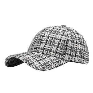 Classic black and white tweed baseball cap with textured check pattern for men and women