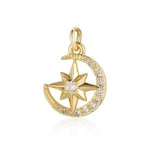 Detailed view of gold moon and star pendant with sparkling zircon inlays on white back