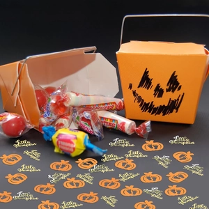 Halloween pumpkin candy boxes with little pumpkin confetti and festive glitter sequins