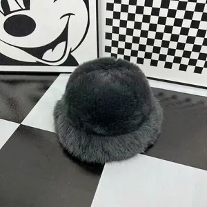 Detailed view of dark grey plush beret featuring thick faux fur texture and round dome