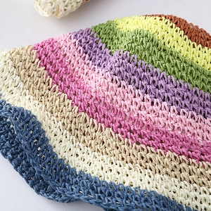 Detailed macro view of colorful rainbow woven straw texture for a summer beach hat
