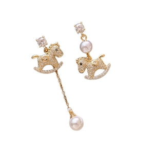 Asymmetric gold plated rocking horse earrings with pearls and shimmering cubic zirconia stones