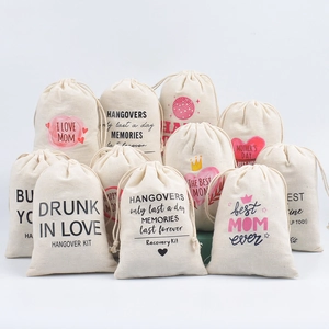 Close-up of cotton linen hangover kit bags with printed recovery text for wedding favors