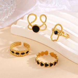 Adjustable gold plated stainless steel rings set with black enamel heart and evil eye motifs