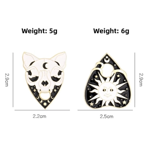 Macro detail showing dimensions and weights of skull cat and sun enamel pin badges
