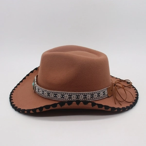 Detail of brown felt fedora featuring ethnic embroidery, turquoise stone and stitched brim