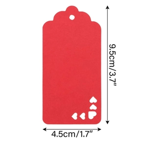 Detail view of a red gift tag with heart cutout and scalloped edge, 9.5x4.5cm size