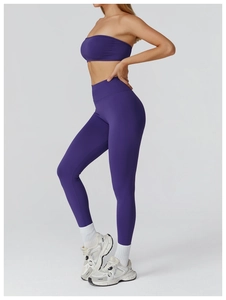 Detail of seamless purple high-waisted yoga leggings and sports bra set for fitness