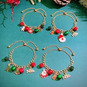 Christmas gold charm bracelet set featuring Santa Claus, reindeer, and snowflake pendants