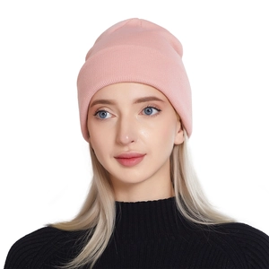 Stylish pink ribbed knit beanie for women, perfect for winter warmth and outdoor fashion