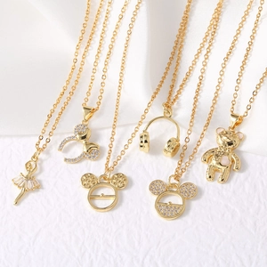 Gold-plated necklaces featuring ballet dancer, Mickey silhouettes, and teddy bear charms