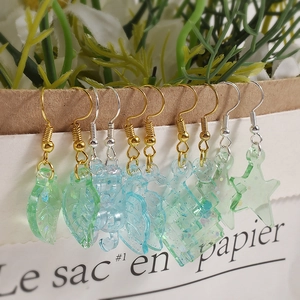 Resin drop earrings set featuring leaf and seahorse shapes in mint green and light blue