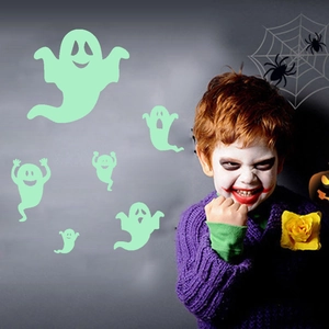 Luminous ghost wall stickers glowing in the dark for spooky Halloween room decoration
