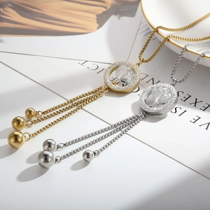 Minimalist long sweater necklace with glass ring pendant and beaded tassels in gold and silver