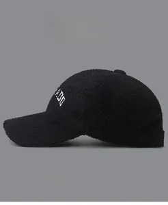 Detail of winter lamb wool baseball cap with letter embroidery and soft plush texture