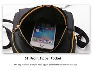 Macro shot of the front zipper pocket on a black nylon backpack showing a smartphone inside