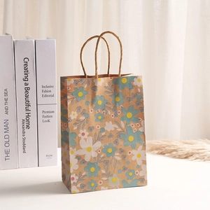 Kraft paper gift bag with autumn floral print and woven handles for party shopping