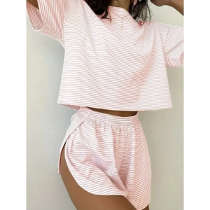 Women's pink striped knit lounge set with short sleeve crop top and drawstring shorts