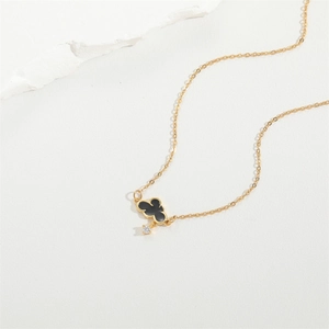 Elegant gold chain necklace featuring a black cloud pendant and a sparkling zircon stone