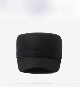Detail view of black wool blend cadet cap with sport label and textured twill fabric