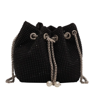 Elegant black bucket bag with sparkling rhinestones, chain strap, and pearl accents